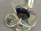 a small silver object that is sitting on a table