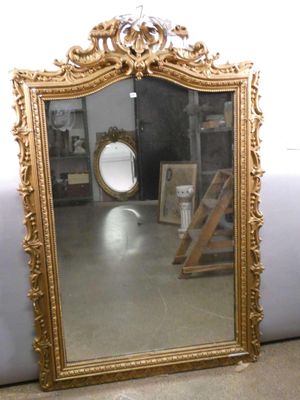 a mirror that is sitting on the floor in a room