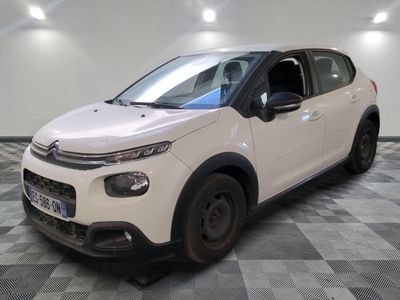 the white citrole is parked in a room with a checkered floor