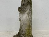 concrete statue of a woman holding a baby in her arms