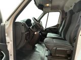 the interior of a white van with black leather seats and a steering wheel