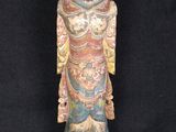 an old wooden statue of a man with a hat on his head