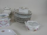 a lot of plates and cups on the table