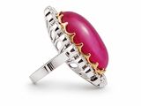 a close up of a ring with a pink stone on it