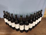 twelve bottles of wine lined up on a wooden table