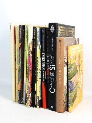 a stack of books sitting on top of each other on a table