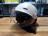 a helmet that is sitting on top of a wooden table