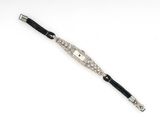 an image of a diamond and black leather bracelet with a clasp