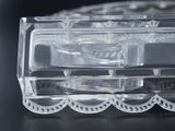 a clear glass box with a lid on a table