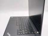 a laptop that is open on a white surface