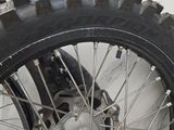 a close up of a motorcycle tire on the ground