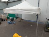 a white tent that is in a garage