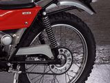 a red motorcycle that is parked in a parking lot