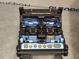 a blue and black machine sitting on top of a table