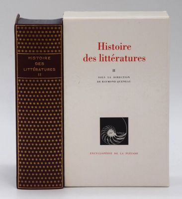 an old book sitting on top of a table next to a book