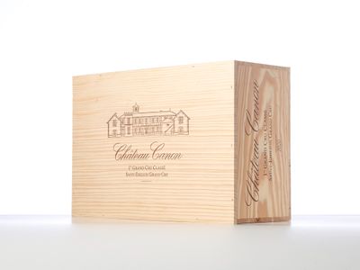 a wooden box with a wine bottle in it sitting on a table
