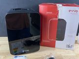 an image of a box with a remote control and a box with a charger