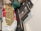 a picture of a room that has a lot of stuff on the floor