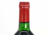 a bottle of wine that is sitting on a table
