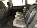 the interior of a car with two rows of seats in it