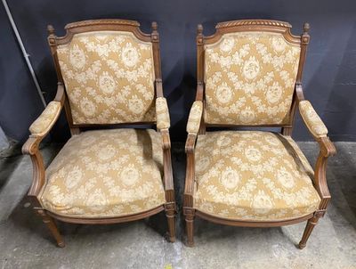 pair of antique chairs with upholstered upholstered arms