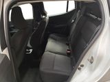 the back seats of a silver car with a black seat belt