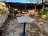 a concrete table sitting in the middle of a yard