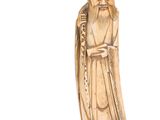 une image représentant une figurine sculptée d'un homme barbu
