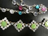 a close up of a necklace on a table