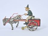 a toy horse pulling a cart with a man on it