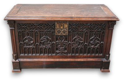 an old wooden chest with ornate carvings on it