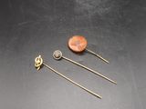 a close up of a pair of pins on a table