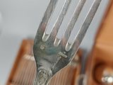 a fork that is stuck in a box of silverware
