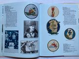 an open book with pictures of people and animals on it