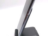 a cell phone that is sitting on top of a stand