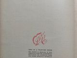 an open book with a drawing of a fish on it