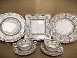 a group of plates and cups and saucers on a table