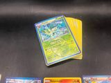 a lot of pokemon cards sitting on a table
