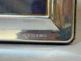 a close up of a silver microwave on a table