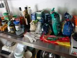 many different types of food on the shelves in the kitchen