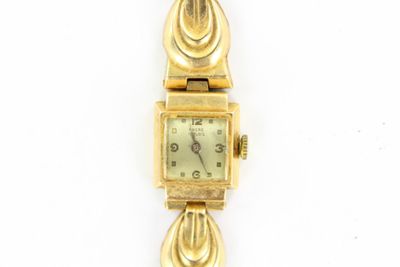 an image of a close up of a wrist watch on a white surface