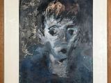 une image représentant un tableau représentant le visage d'un homme, dans un cadre en bois