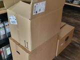 many boxes stacked on top of each other in a store