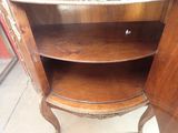 a wooden cabinet with a glass door on it