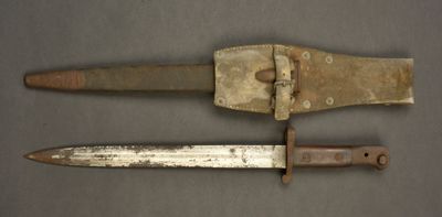 an old knife and an old knife on a table