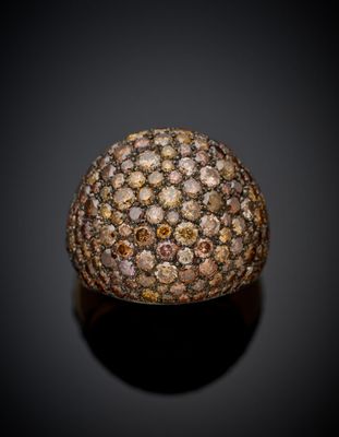 a gold ring with brown and white diamonds