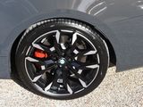 a close up view of a car ' s wheels and rims
