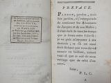 an old book with writing on it sitting on a table