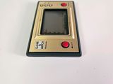 a small electronic device sitting on a white surface