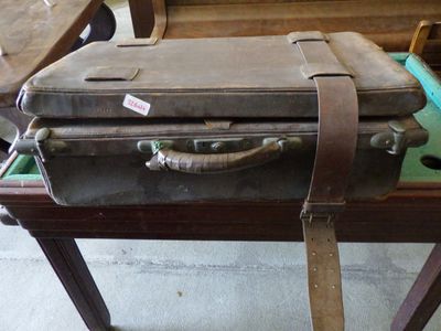 a suitcase sitting on top of a table in a room